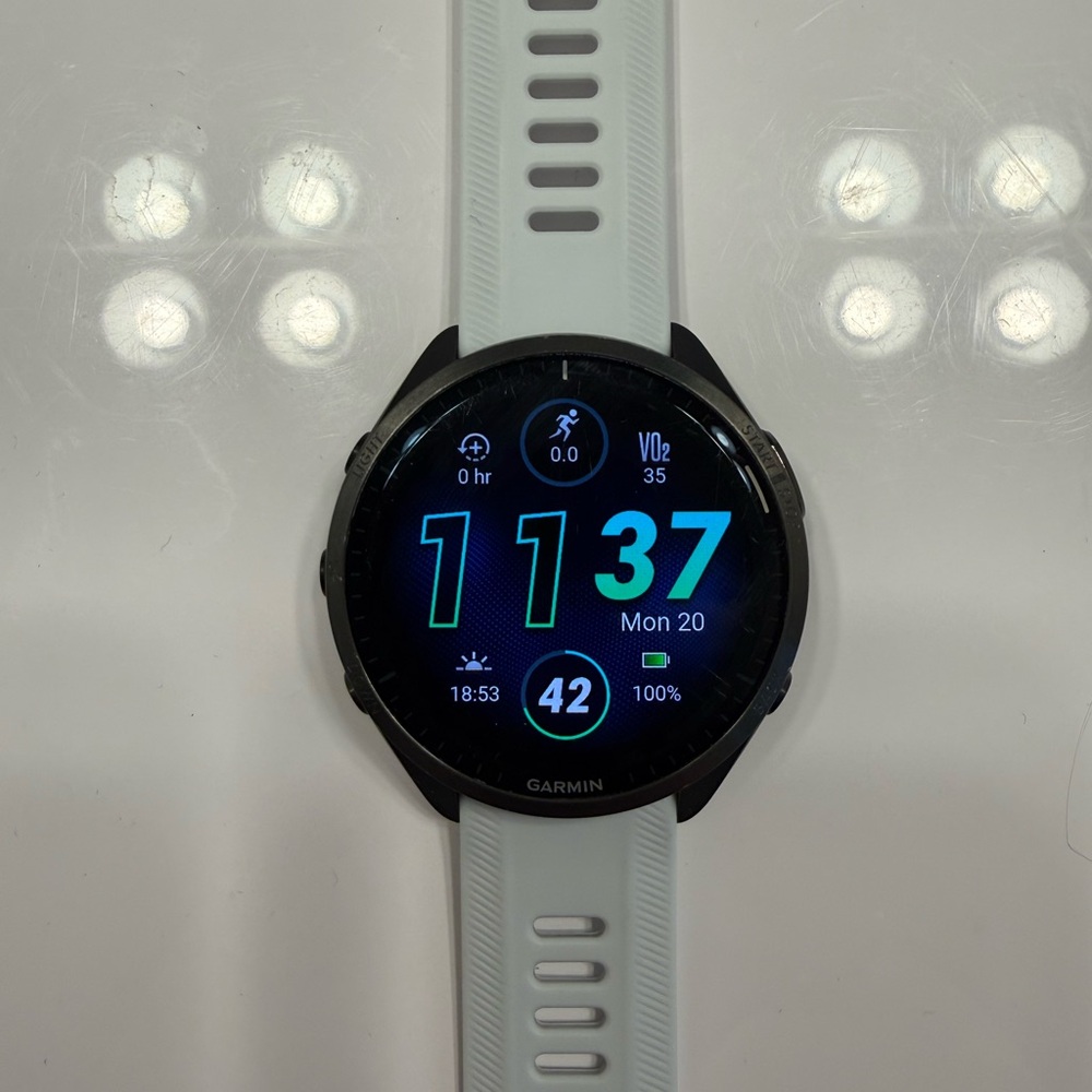 Garmin Smartwatch with Black Dial and White Strap